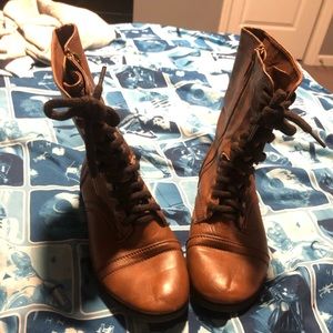Brown leather combat boots with zipper closure
